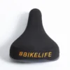 Selle BIKELIFE Noire Logo Orange -Pieces Cycliste Magasin selle bikelife noire logo orange